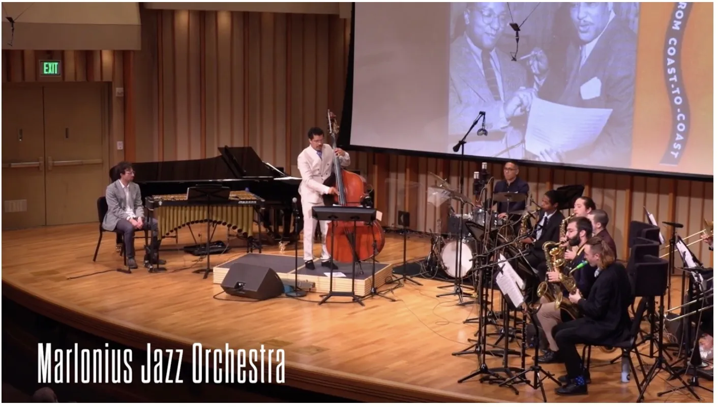 Marlon Martinez and the Marlonius Jazz Orchestra perform with Billy Strayhorn’s portrait behind them.